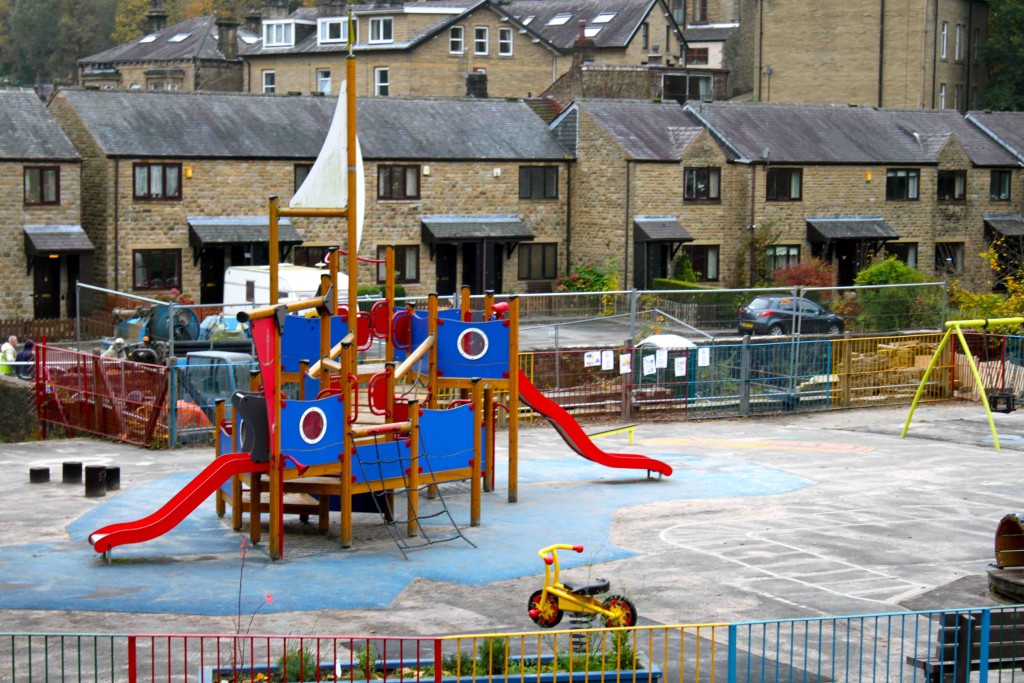 Little Park with pirate ship and toddler swings on far right